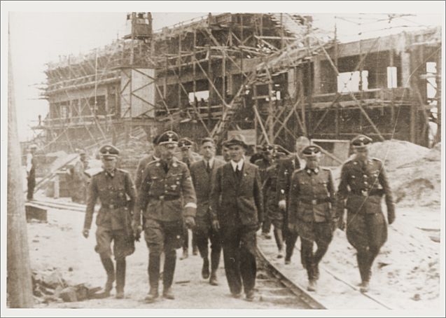 Reichsfuehrer SS Heinrich Himmler tours the Monowitz-Buna building site in the company of SS officers and IG Farben engineers